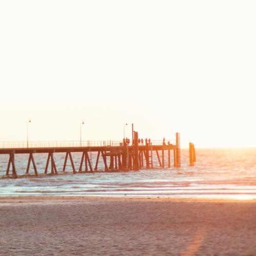 Jetty on a beach at sunset - Australian Stock Image