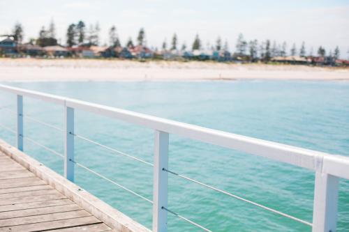 Jetty railing overlooking a beach