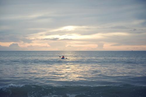 Kayaker alone at sunset - Australian Stock Image