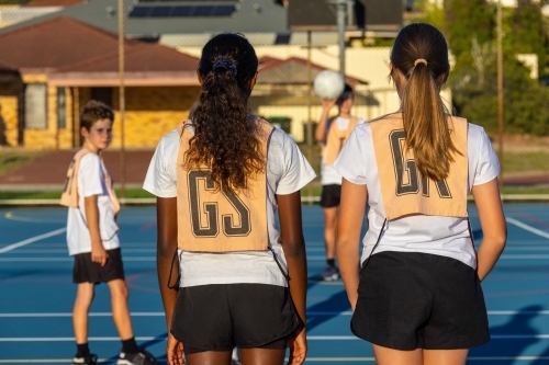 kids netball team on court at training - Australian Stock Image