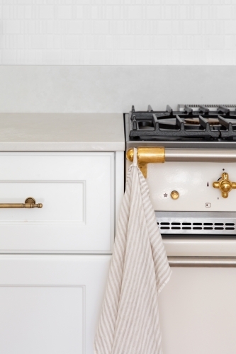 Kitchen with traditional stove and shaker profile joinery - Australian Stock Image