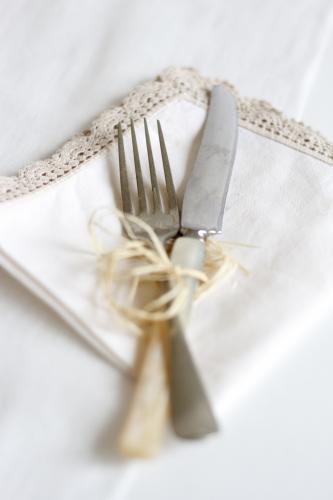 Knife and Fork tied with twine on napkin - Australian Stock Image