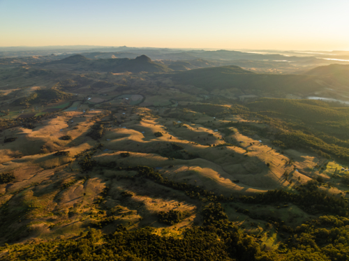Landscape of undulating farmland and hills - Australian Stock Image
