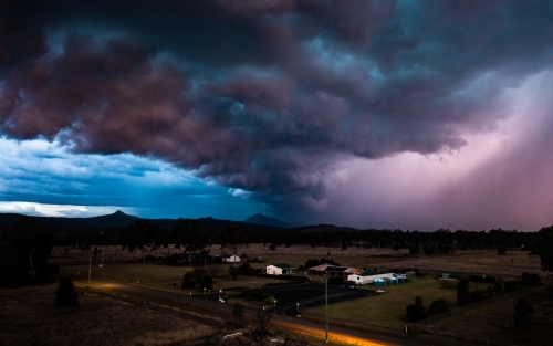 Landscape with dramatic storm clouds at sunset - Australian Stock Image