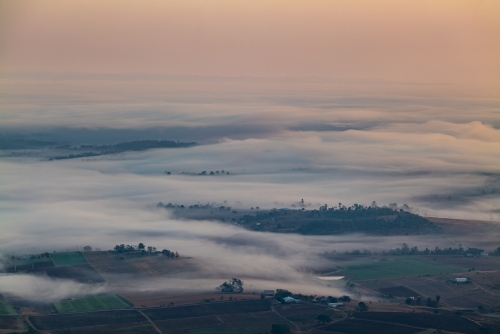 Landscape with early morning  fog and low clouds in the Scenic Rim - Australian Stock Image