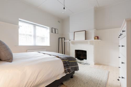 Large older style renovated apartment in white and wood Danish styling - Australian Stock Image