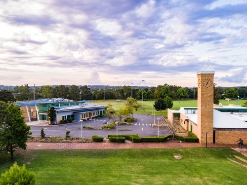 Library with empty carpark and footpath to clock tower - Australian Stock Image