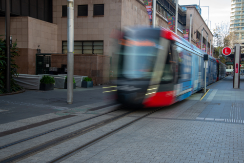 Light rail public transport at Circular Quay, Sydney shot with a long exposure - Australian Stock Image