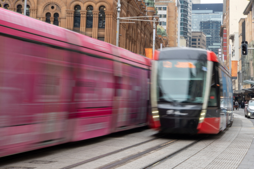 Light rail trams in the city on George Street, Sydney - Australian Stock Image