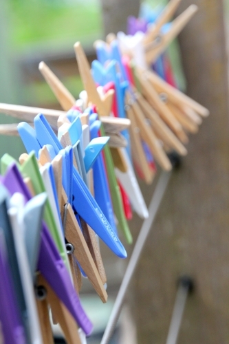 Line of pegs on wire - Australian Stock Image