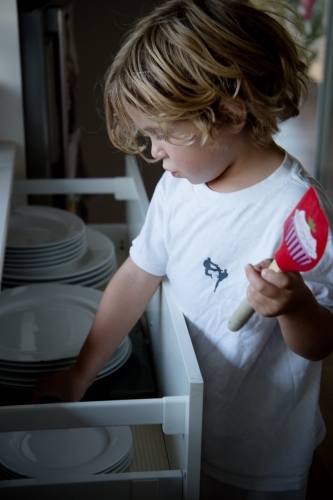 Little boy cooking - Australian Stock Image