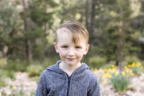 Little boy outdoors looking at the camera - Australian Stock Image