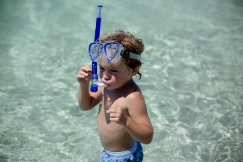 Little boy snorkelling in the ocean - Australian Stock Image