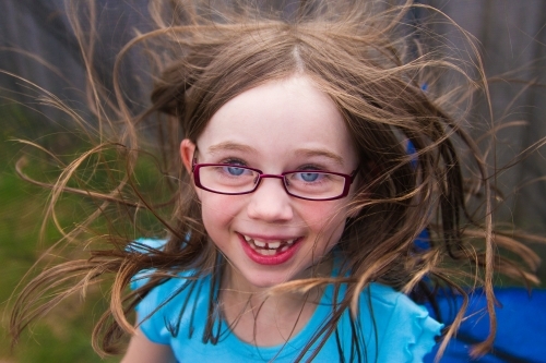 Little girl jumping on the trampoline - Australian Stock Image