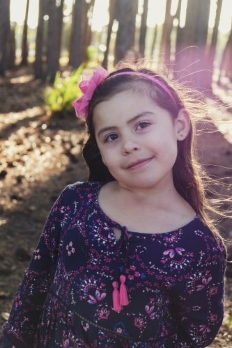 Little multicultural girl in the wood - Australian Stock Image