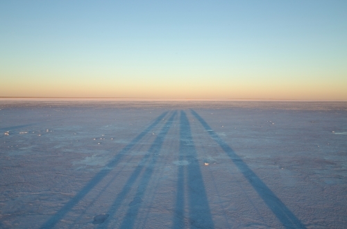 long shadows on salt lake - Australian Stock Image