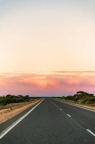 Long straight open road heading East on the Eyre Highway, Western Australia - Australian Stock Image