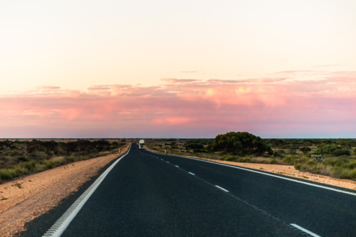 Long straight open road heading East on the Eyre Highway, Western Australia - Australian Stock Image