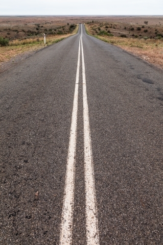 Long straight road with double unbroken lines - Australian Stock Image