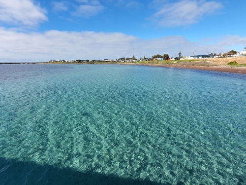 looking across water to seaside town - Australian Stock Image