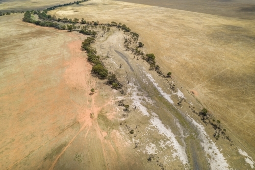 Looking down on a dried up creek bed during drought. - Australian Stock Image