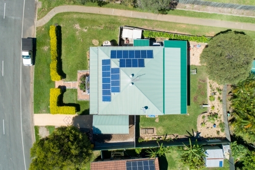 Looking down on house with metal roof and solar panels. - Australian Stock Image