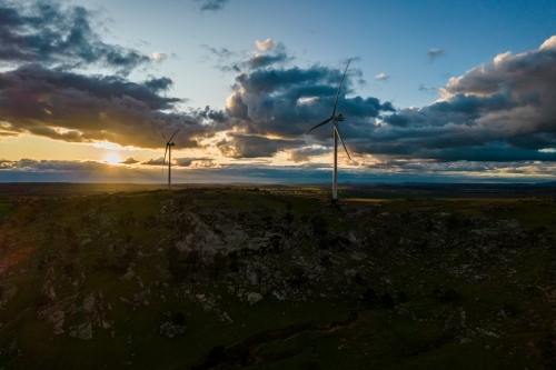 Looking down on wind turbines at sunrise. - Australian Stock Image