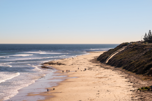 Looking down towards of people on beach, Seaford Beach, South Australia - Australian Stock Image