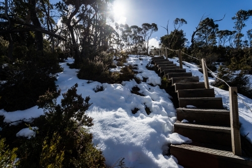 Looking up a flight of steps in the snow - Australian Stock Image