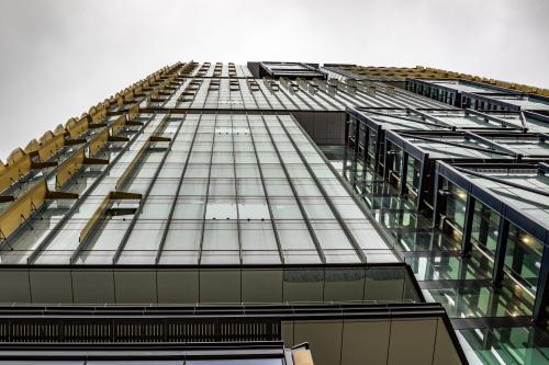 Looking up at a skyscraper on an overcast day - Australian Stock Image