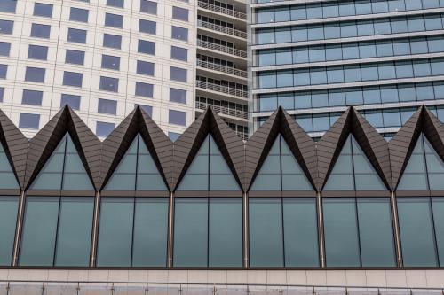 Looking up at city buildings with creative architecture - Australian Stock Image