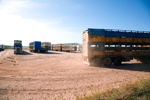 Lorries parked on dirt in outback - Australian Stock Image