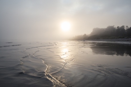 Low sunlight against ocean ripples - Australian Stock Image