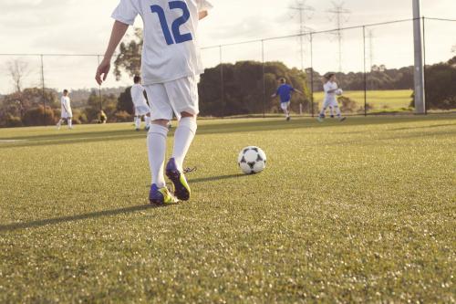 Low view of kids soccer training - Australian Stock Image