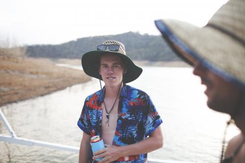 Male on Lake Eildon House Boat - Australian Stock Image