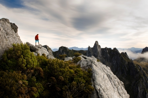 Man alone on mountainscape - Australian Stock Image