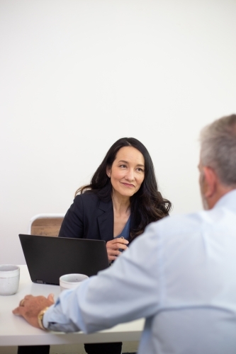 Man and woman collaborating in an office - Australian Stock Image