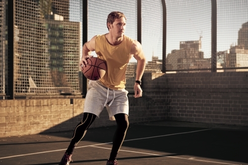 Man basketball pass - Australian Stock Image