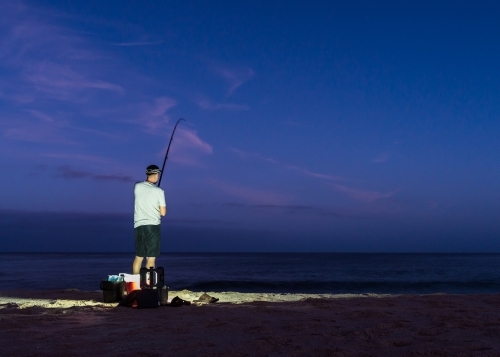 Man Beach Fishing in the Early Morning - Australian Stock Image