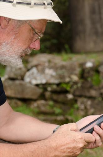 Man looking at his smart phone - Australian Stock Image