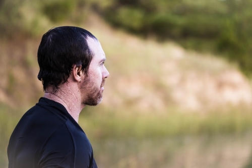 Man looking out into distance - Australian Stock Image