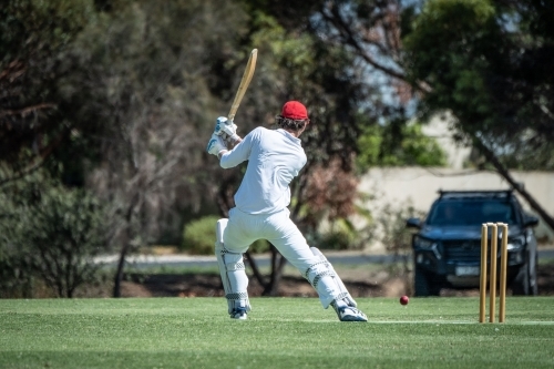 Man playing cricket in Country South Australia - Australian Stock Image