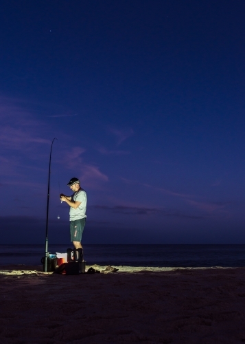 Man Preparing For Pre Dawn Fishing - Australian Stock Image