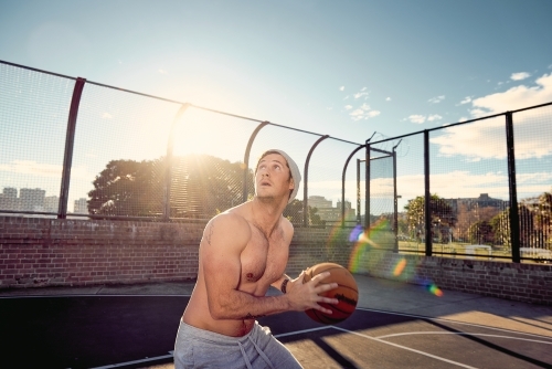 Man ready to shoot basketball - Australian Stock Image