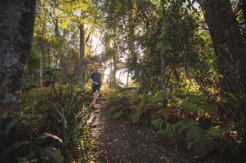 Man running in bush - Australian Stock Image