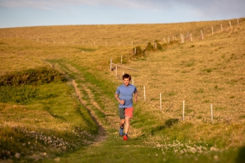 Man Running Towards Camera in Countryside - Australian Stock Image