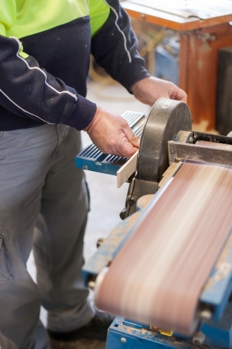 Man sanding at a Men's Shed - Australian Stock Image