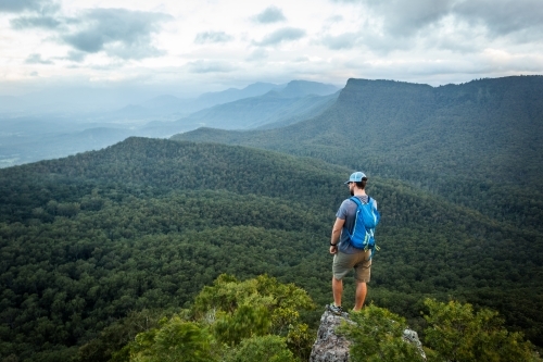 Man standing on Mountaintop - Australian Stock Image