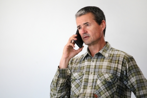 Man talking on mobile phone - Australian Stock Image