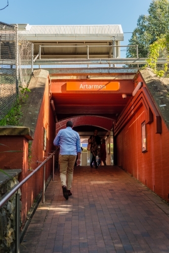 man walking to train station - Australian Stock Image
